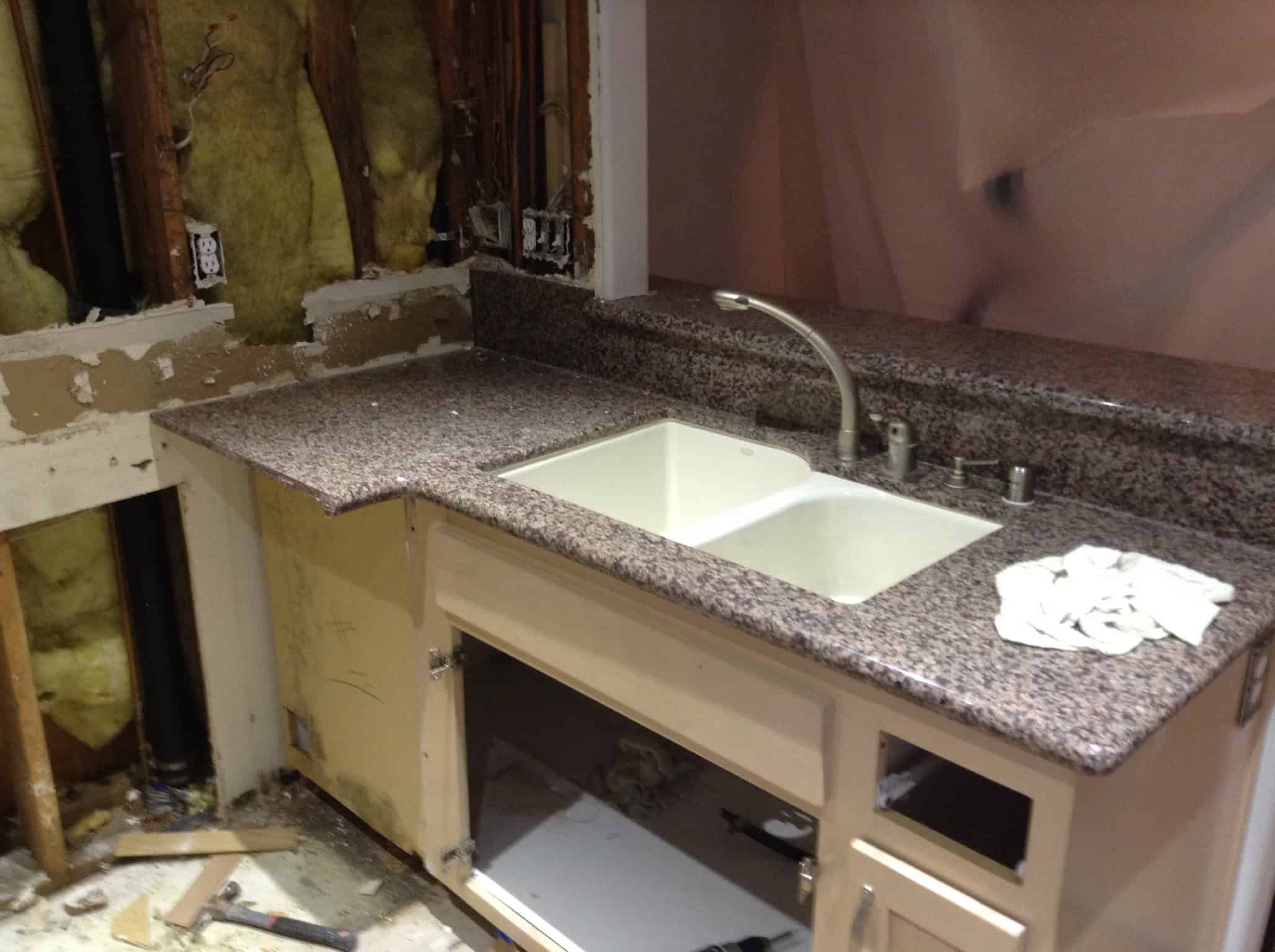Standing water affecting flooring before mitigation work