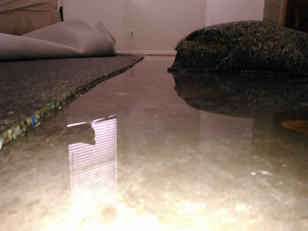 Standing water requiring emergency water cleanup in Newport Beach