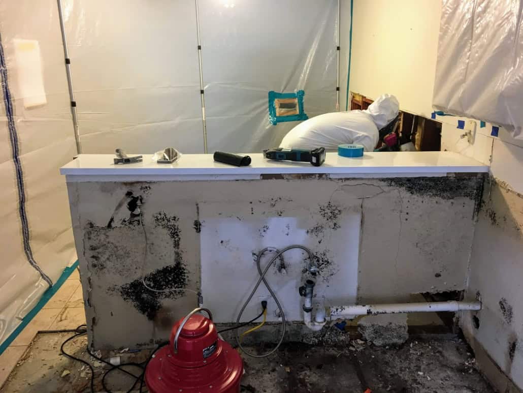 Containment barriers installed during a Ranch Mission Viejo mold removal project involving kitchen moisture damage and remediation