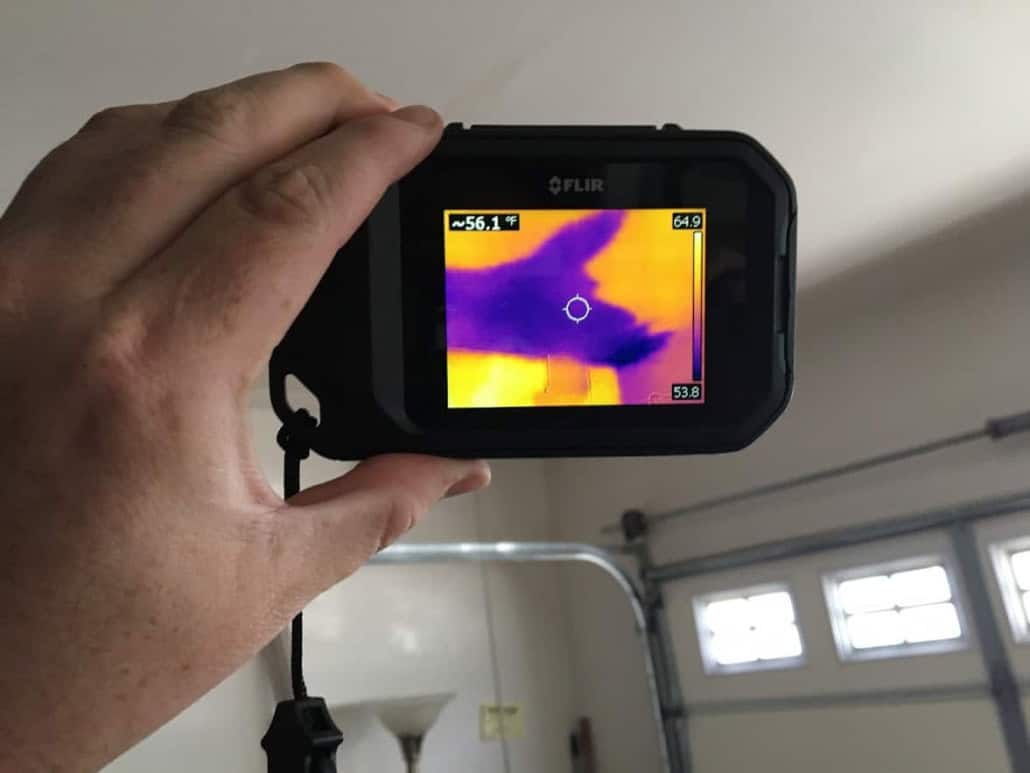 Infrared moisture inspection identifying hidden water intrusion inside a Tustin property